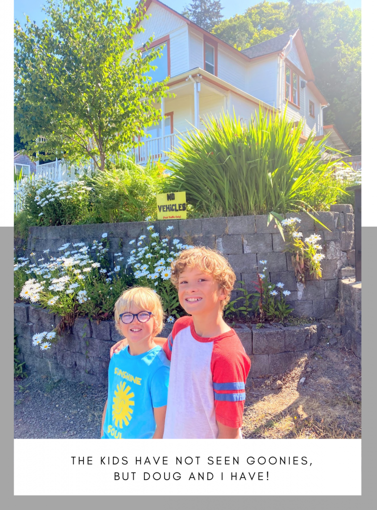 Kids standing in front of the Goonie's House in Astoria. 