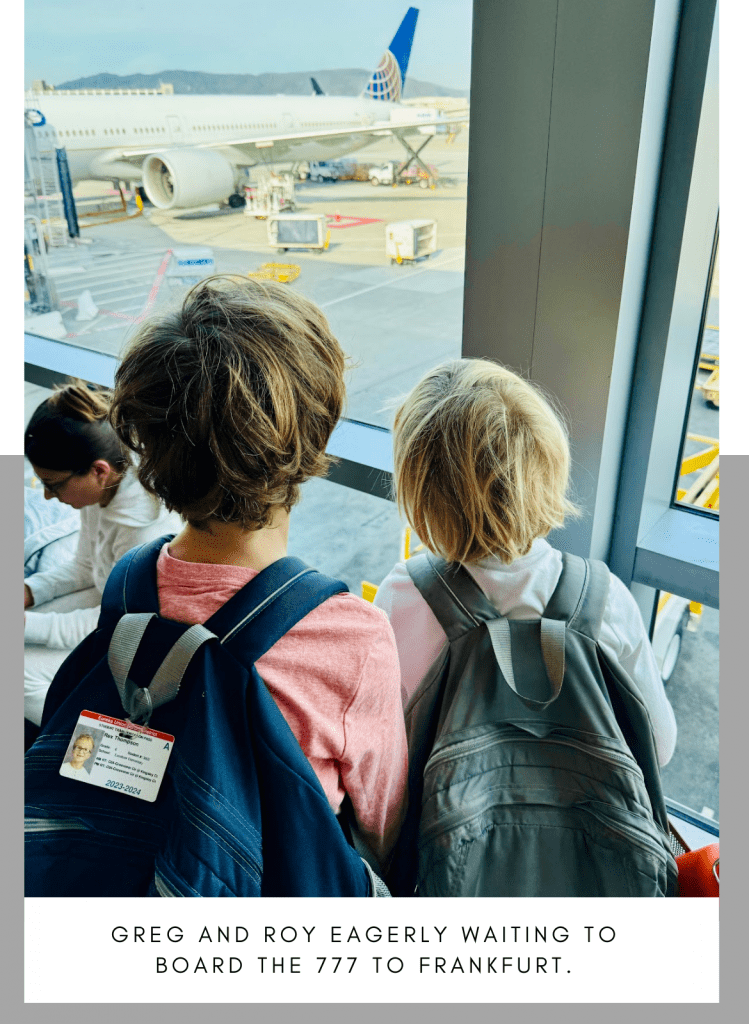 The boys eagerly awaiting boarding for UA Flight 58, a Boeing-777, to Frankfurt. 