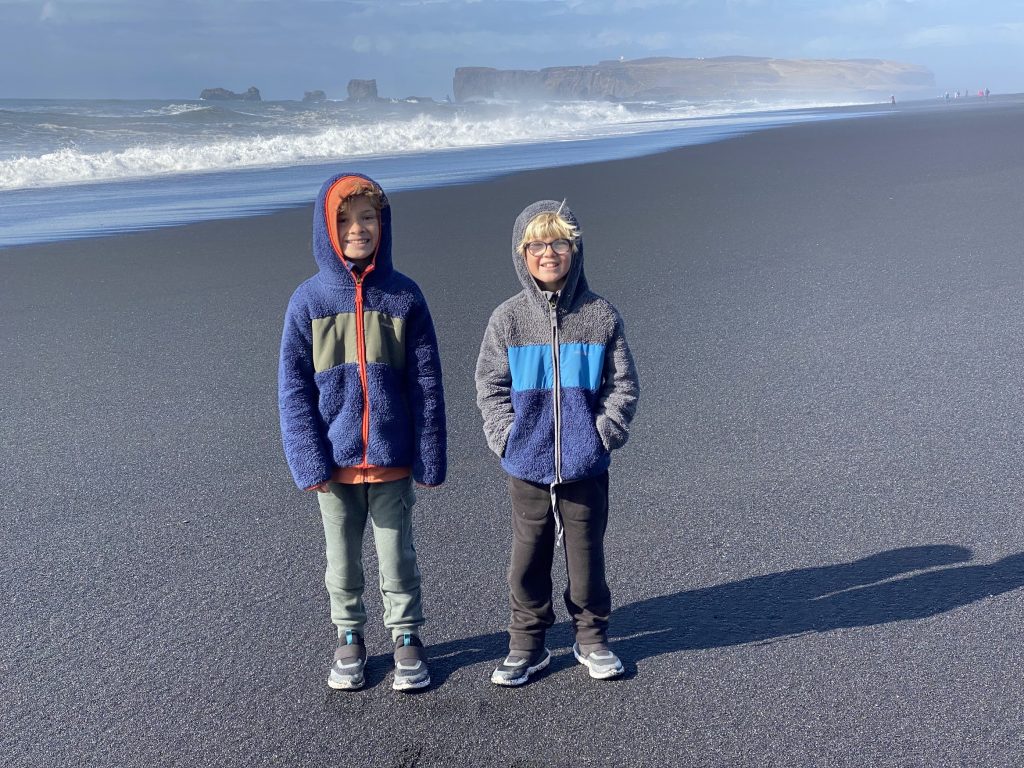 Kids on Black Sand Beach in Vik. 