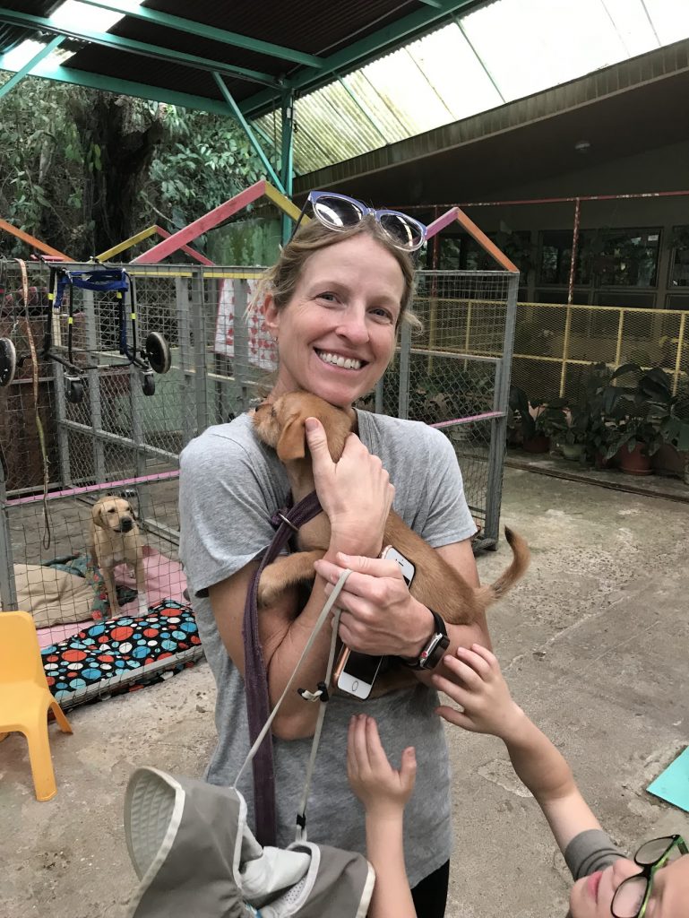 Holding a puppy at Lands in Love Hotel & Resort