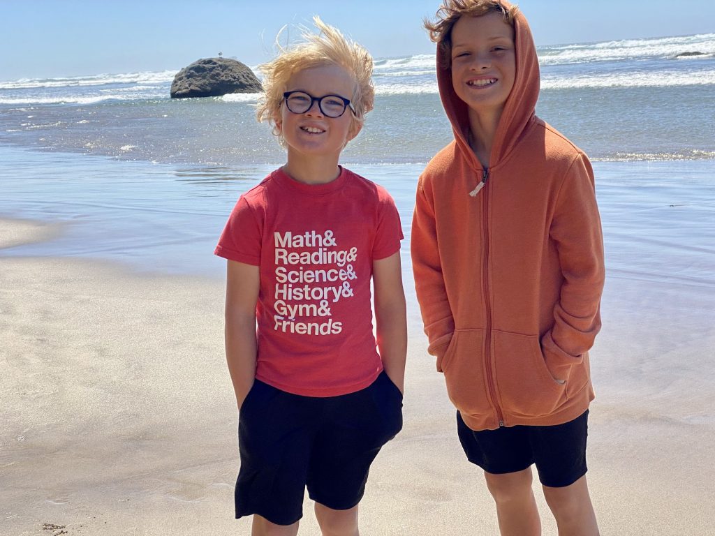 Kids standing on the beach at Hug Point.