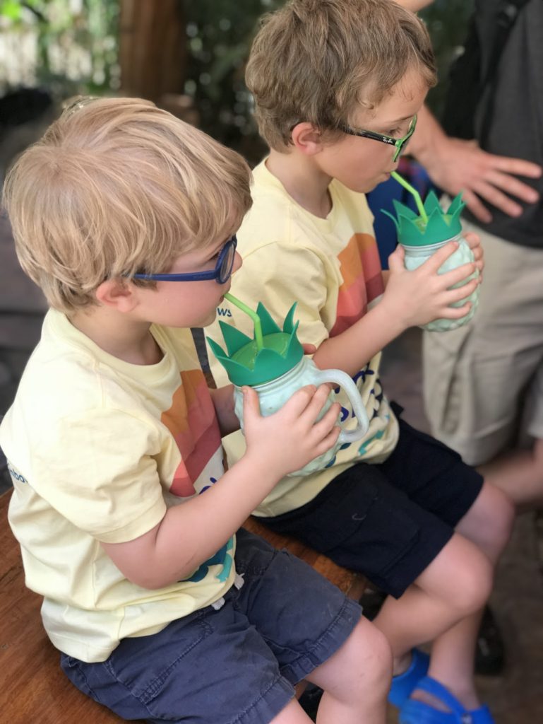 Kids sipping mango juice at Ocho Artisan Bungalows