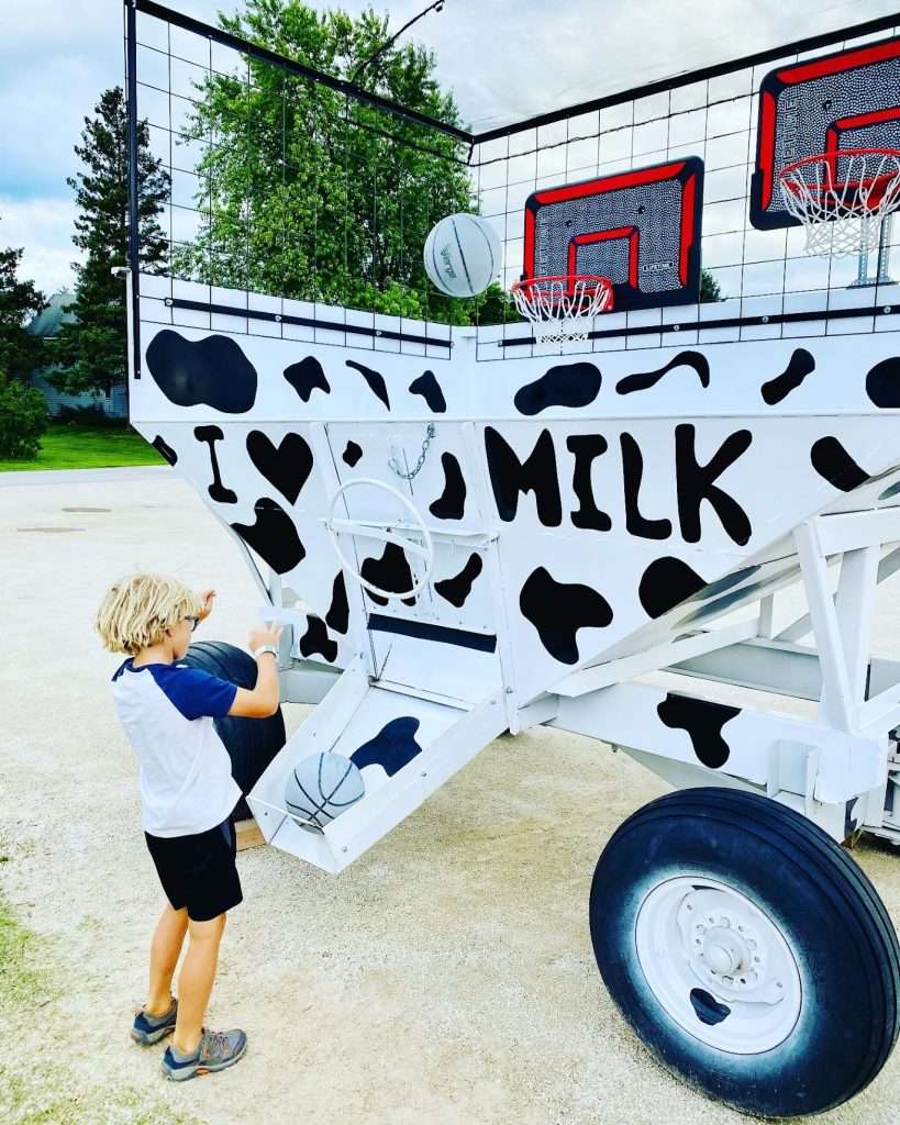 Waiting for a table at Homestead Kitchen and Tap, by playing basketball into a milk trough. 