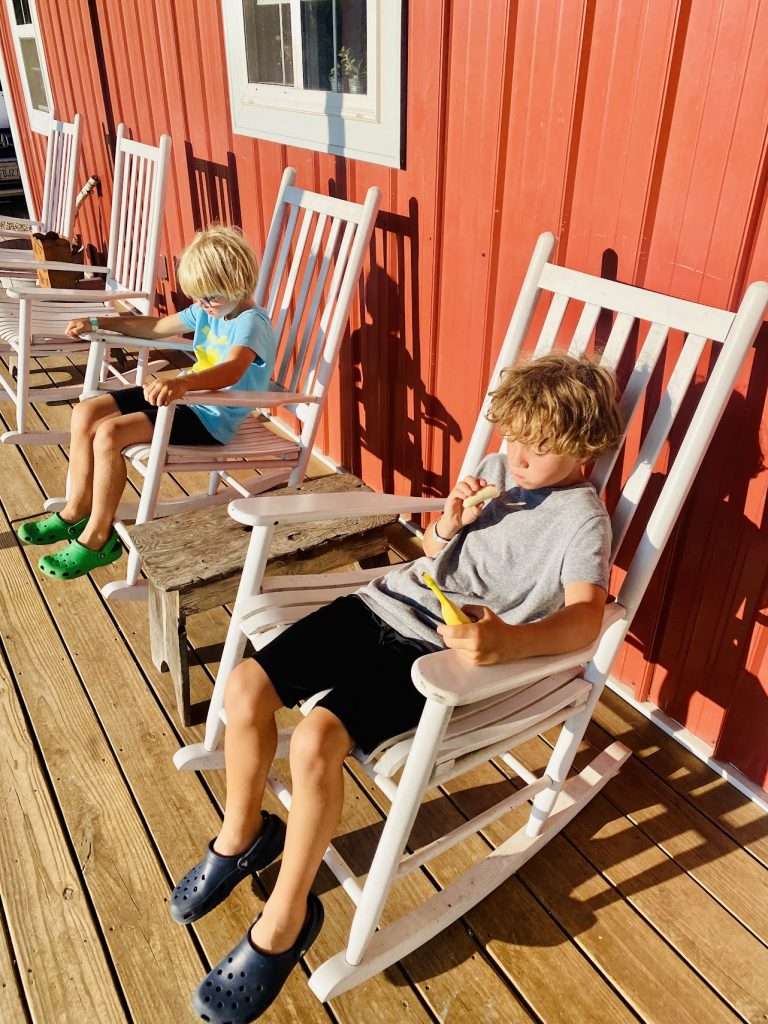 Sitting on the front porch of the Honey Barn in Westby.