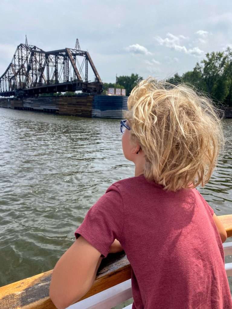 Watching the bridges go by on the Mississippi River in Wisconsin.