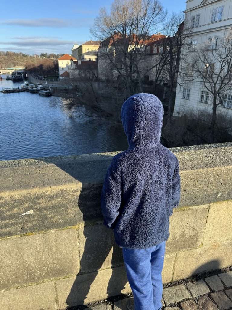 Looking out at the water on St. Charles Bridge, Prague.